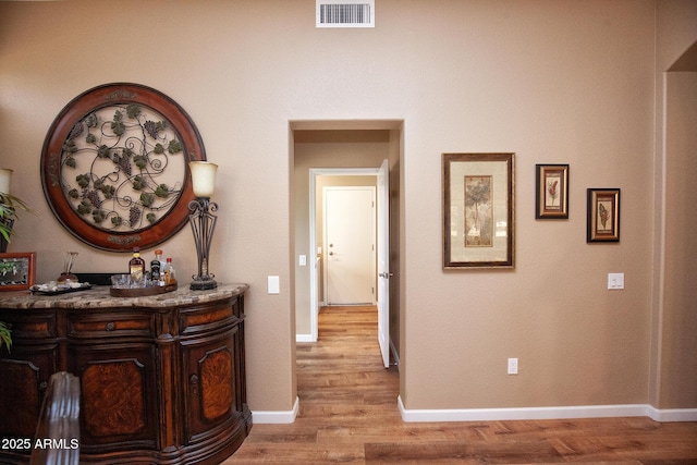 hall featuring light hardwood / wood-style flooring