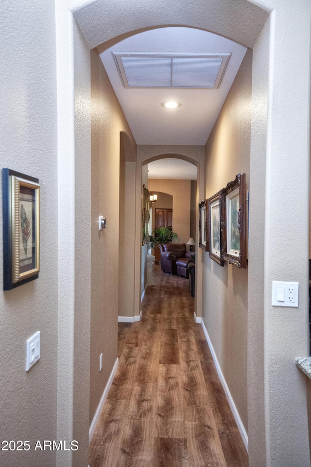 hallway featuring dark wood-type flooring