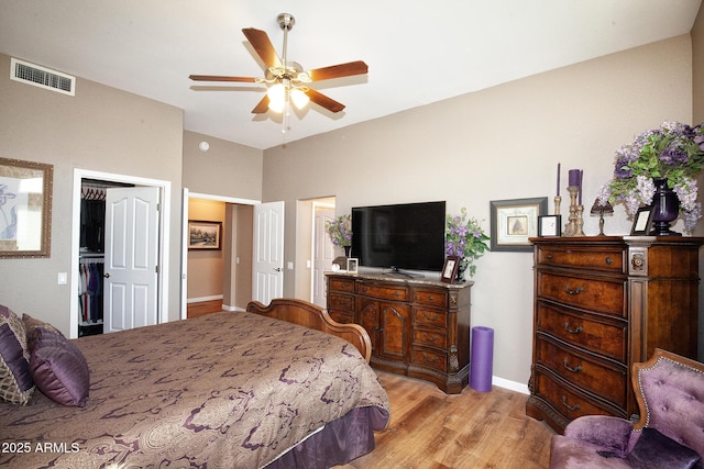 bedroom with ceiling fan and light hardwood / wood-style flooring