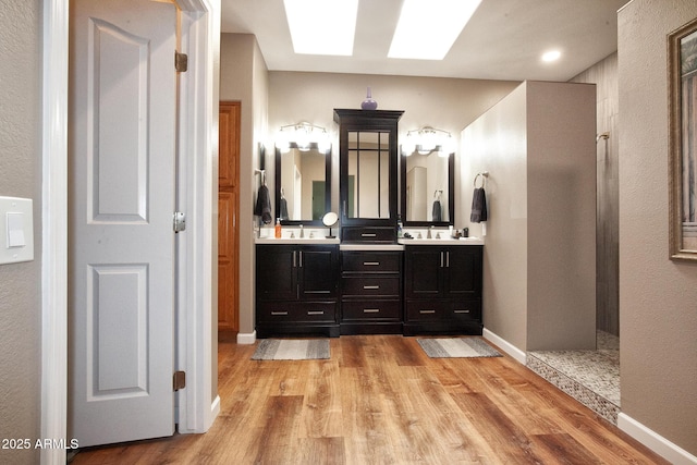 bathroom with hardwood / wood-style floors and vanity