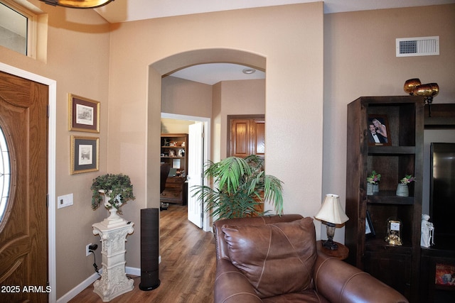 entrance foyer with dark hardwood / wood-style floors