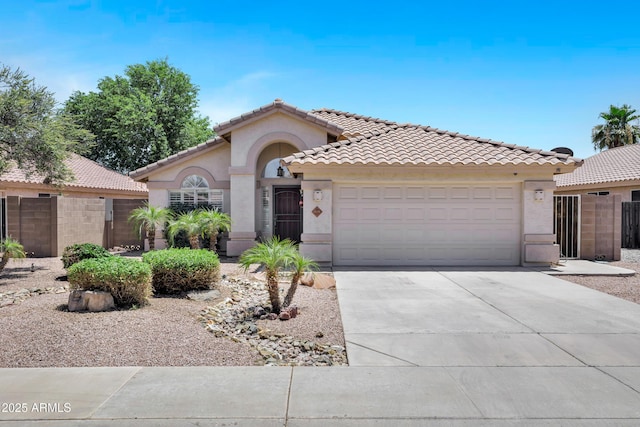625 W Douglas Ave, Gilbert, AZ 85233 - mediterranean / spanish house with stucco siding, an attached garage, concrete driveway, and a tiled roof