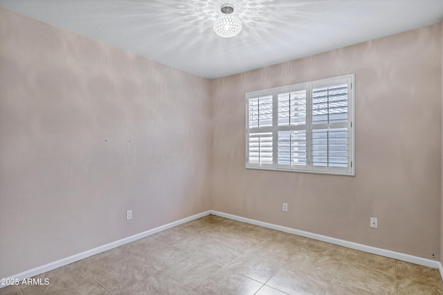 625 W Douglas Ave, Gilbert, AZ 85233 - unfurnished room featuring baseboards and a chandelier