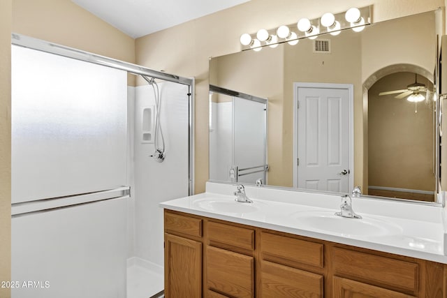 625 W Douglas Ave, Gilbert, AZ 85233 - bathroom with a shower stall, double vanity, and a ceiling fan