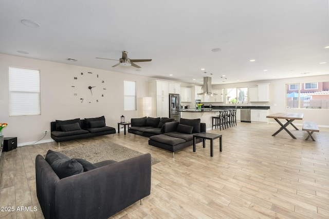 3247 E Creosote Ln, Gilbert, AZ 85298 - living room featuring a ceiling fan, light wood-style floors, recessed lighting, and baseboards