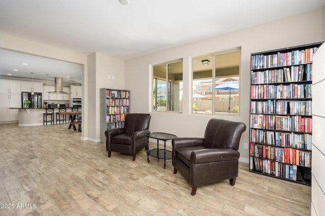 3247 E Creosote Ln, Gilbert, AZ 85298 - sitting room with light wood-style flooring, baseboards, and recessed lighting