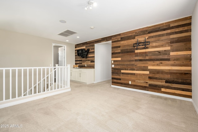 3247 E Creosote Ln, Gilbert, AZ 85298 - unfurnished room featuring wooden walls, light carpet, and recessed lighting
