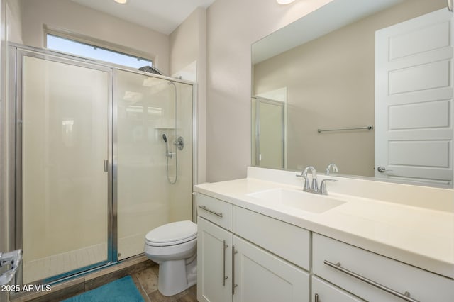3247 E Creosote Ln, Gilbert, AZ 85298 - bathroom with vanity, a stall shower, toilet, and wood finished floors