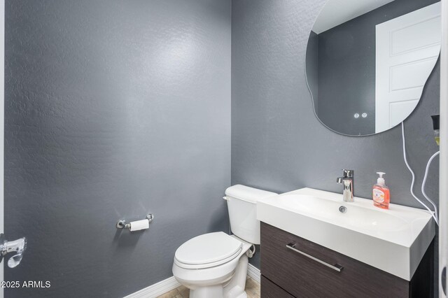 3247 E Creosote Ln, Gilbert, AZ 85298 - bathroom with toilet, vanity, and baseboards