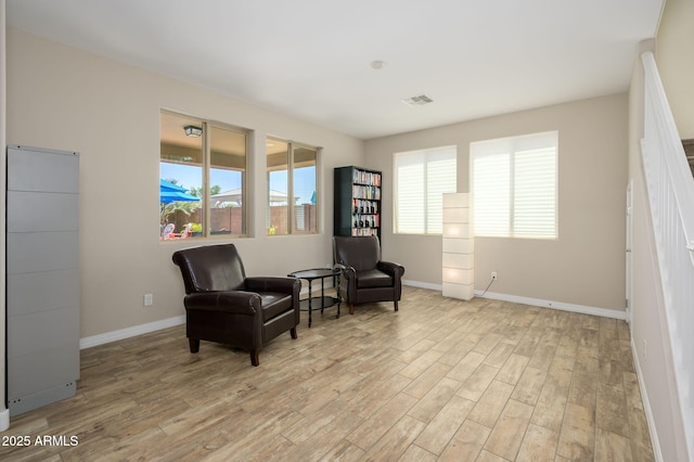3247 E Creosote Ln, Gilbert, AZ 85298 - sitting room with light wood finished floors and baseboards