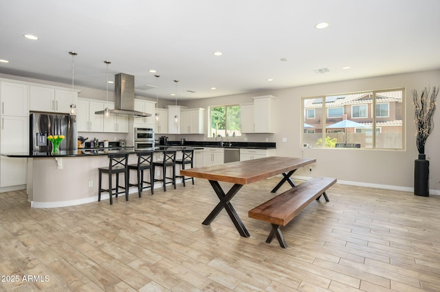 3247 E Creosote Ln, Gilbert, AZ 85298 - dining area with light wood finished floors, recessed lighting, and baseboards