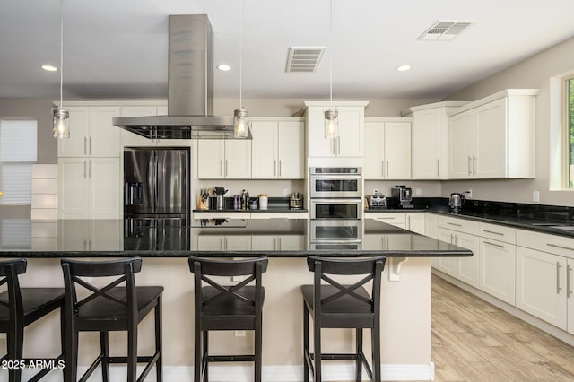 3247 E Creosote Ln, Gilbert, AZ 85298 - kitchen with stainless steel appliances, island exhaust hood, white cabinets, and recessed lighting