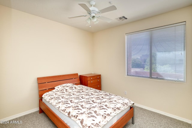 bedroom featuring ceiling fan and light colored carpet