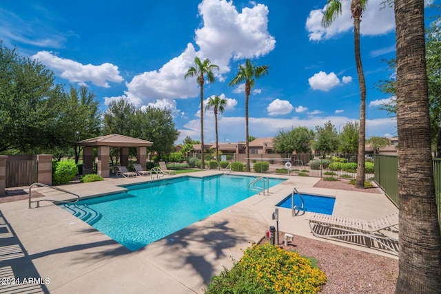 view of swimming pool with a gazebo and a patio