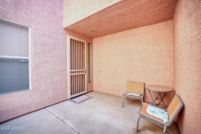 doorway to property featuring a patio area