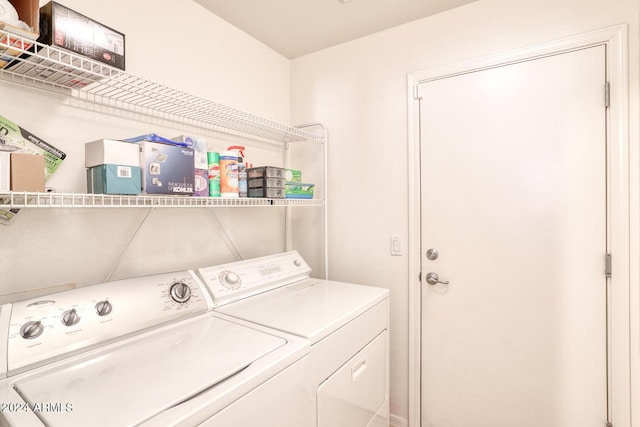 clothes washing area featuring washing machine and clothes dryer