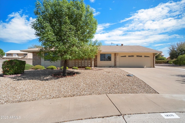 ranch-style home with a garage, concrete driveway, fence, and a tiled roof