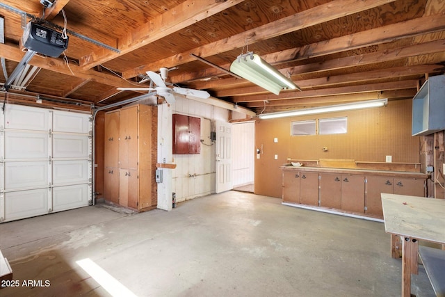 garage featuring a workshop area and a garage door opener