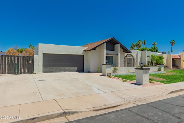 862 W Javelina Ave, Mesa, AZ 85210 - view of front facade featuring stucco siding, driveway, and an attached garage