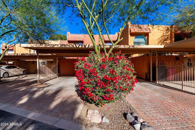 view of front of property featuring a carport