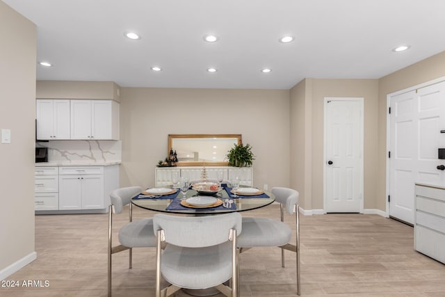 dining area featuring light wood-type flooring