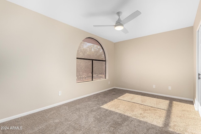 carpeted empty room with ceiling fan