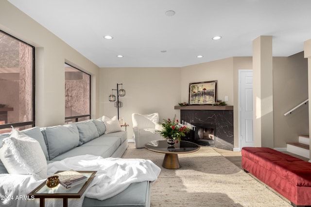 living room featuring a premium fireplace