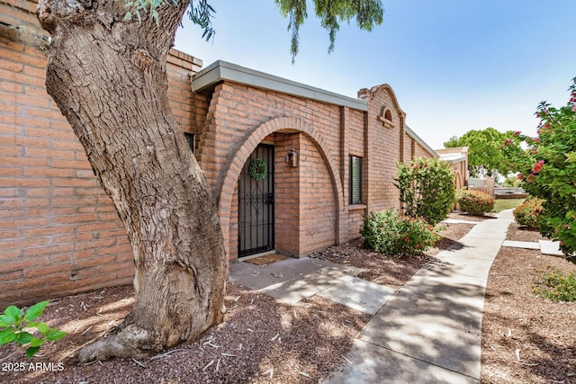 4414 E Hubbell St Unit 66, Phoenix, AZ 85008 - doorway to property featuring brick siding and a gate