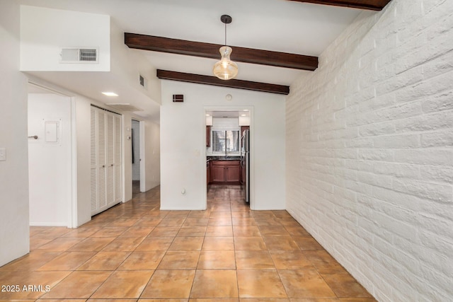 4414 E Hubbell St Unit 66, Phoenix, AZ 85008 - unfurnished room with light tile patterned floors and beam ceiling