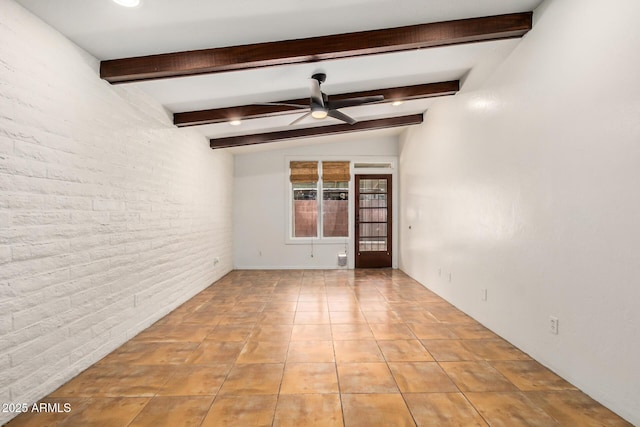 4414 E Hubbell St Unit 66, Phoenix, AZ 85008 - spare room featuring ceiling fan, beam ceiling, light tile patterned flooring, and brick wall