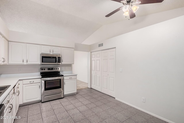 kitchen featuring white cabinets, stainless steel appliances, a ceiling fan, and visible vents