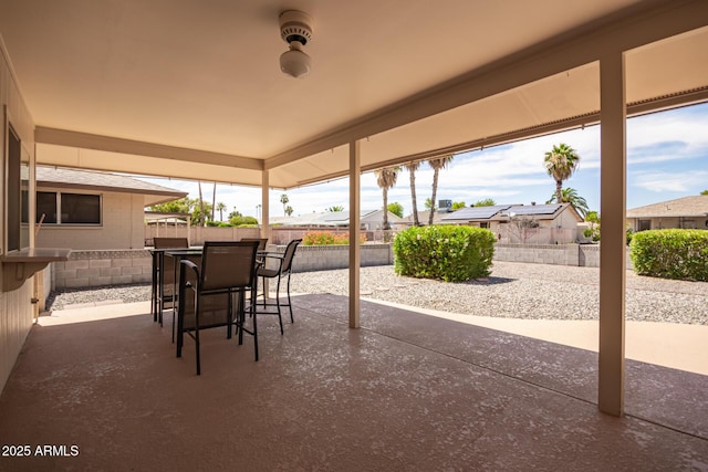 view of patio featuring an outdoor bar