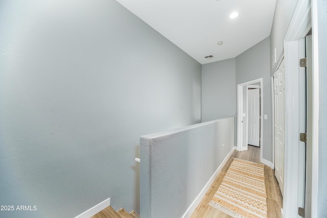 2402 E 5th St Unit 1498, Tempe, AZ 85288 - hallway with an upstairs landing, wood finished floors, and baseboards