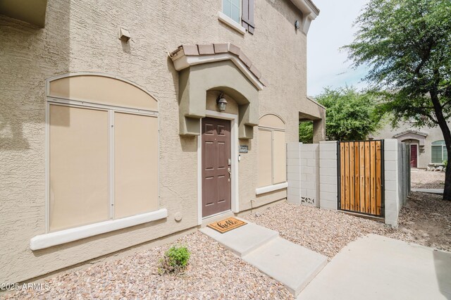 2402 E 5th St Unit 1498, Tempe, AZ 85288 - property entrance with a gate and stucco siding