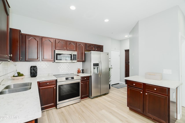 2402 E 5th St Unit 1498, Tempe, AZ 85288 - kitchen with stainless steel appliances, dark brown cabinets, tasteful backsplash, and recessed lighting