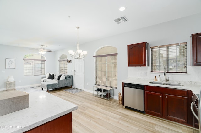 2402 E 5th St Unit 1498, Tempe, AZ 85288 - kitchen featuring dishwasher, dark brown cabinets, a sink, light wood-style flooring, and tasteful backsplash