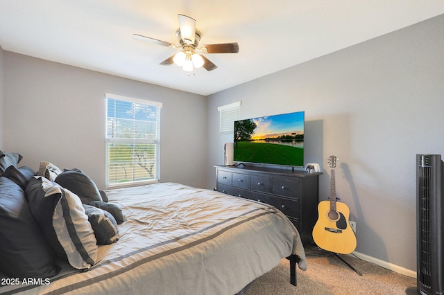 bedroom with ceiling fan and carpet