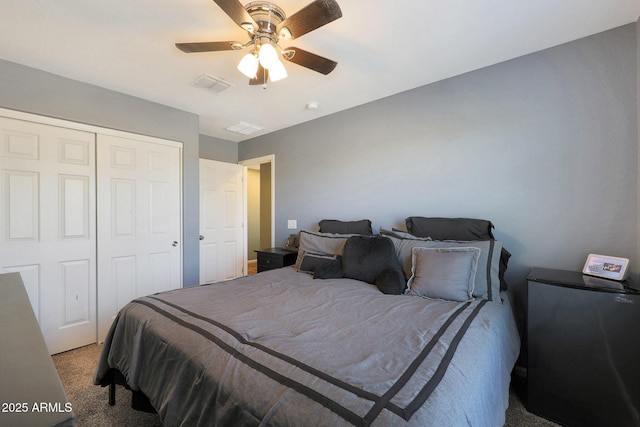 carpeted bedroom featuring a closet and ceiling fan