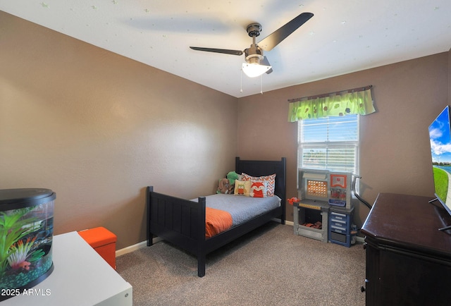 bedroom featuring ceiling fan and carpet