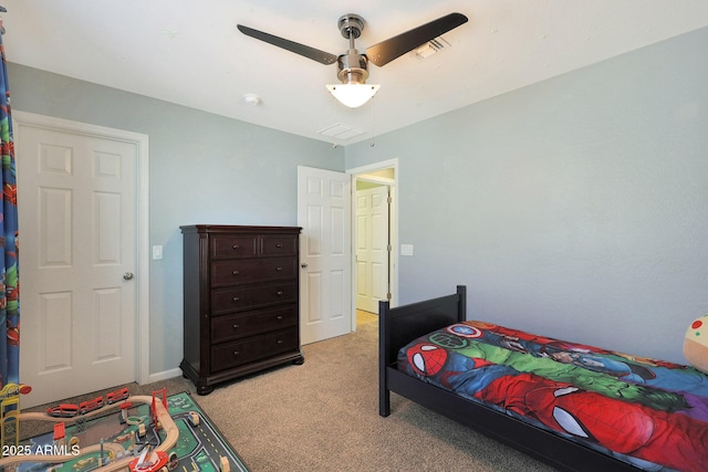 carpeted bedroom with ceiling fan