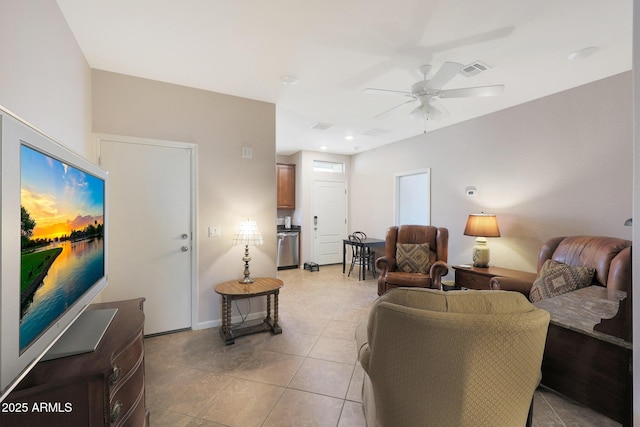 tiled living room featuring ceiling fan