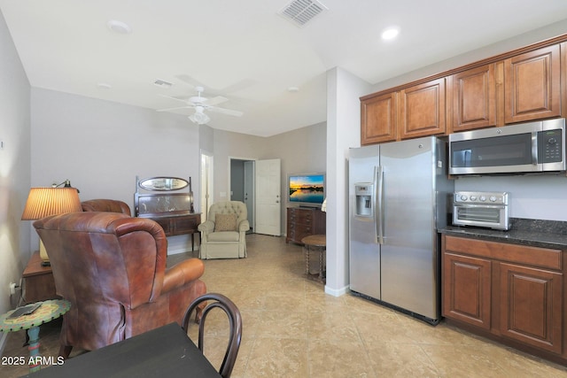 kitchen with ceiling fan and stainless steel appliances