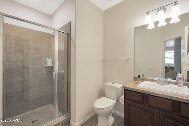 bathroom featuring vanity, toilet, and a shower with door