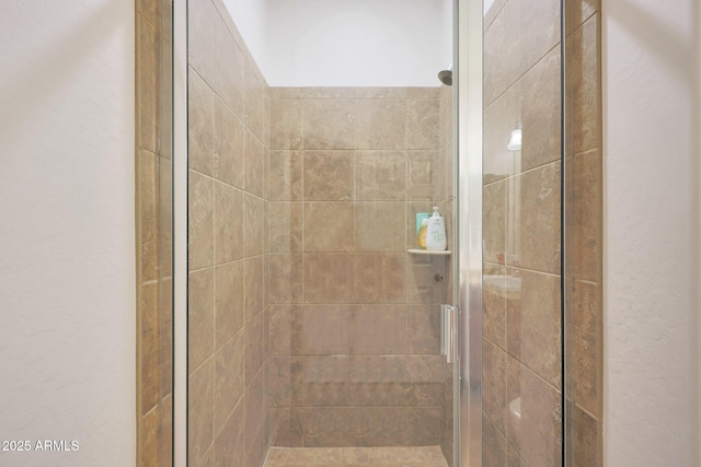 bathroom featuring an enclosed shower