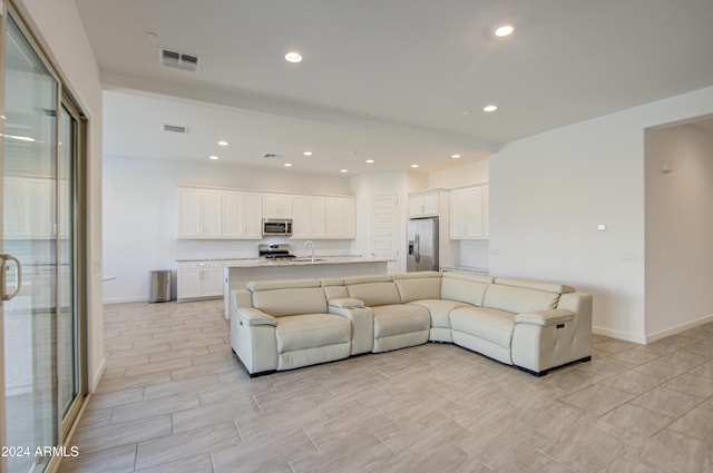 2228 E Isaiah Ave, Gilbert, AZ 85298 - living area with baseboards and recessed lighting