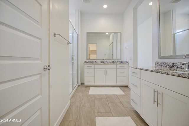 2228 E Isaiah Ave, Gilbert, AZ 85298 - full bath featuring a shower stall, two vanities, and recessed lighting