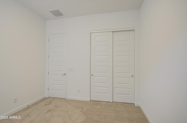 2228 E Isaiah Ave, Gilbert, AZ 85298 - unfurnished bedroom with light carpet, a closet, and baseboards