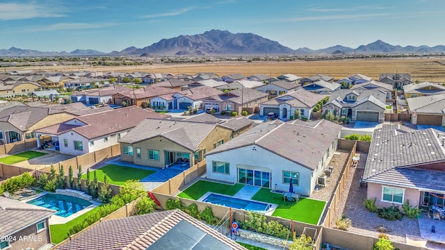 2228 E Isaiah Ave, Gilbert, AZ 85298 - aerial view of residential area with a pool and a mountain backdrop