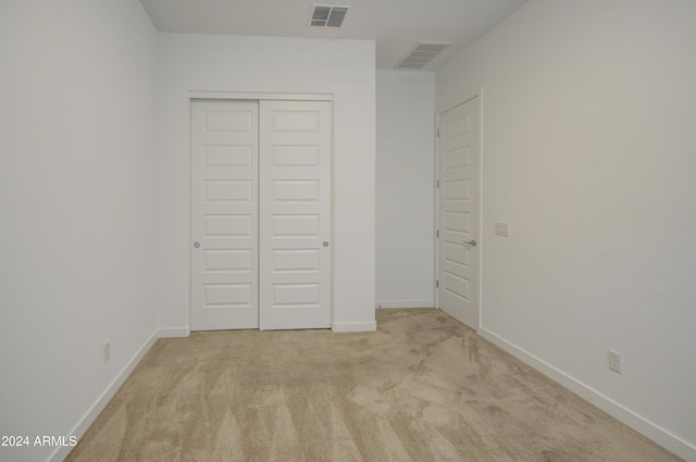 2228 E Isaiah Ave, Gilbert, AZ 85298 - unfurnished bedroom with light carpet, a closet, and baseboards