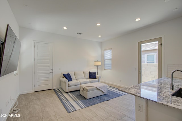 2228 E Isaiah Ave, Gilbert, AZ 85298 - living room with healthy amount of natural light, recessed lighting, and baseboards